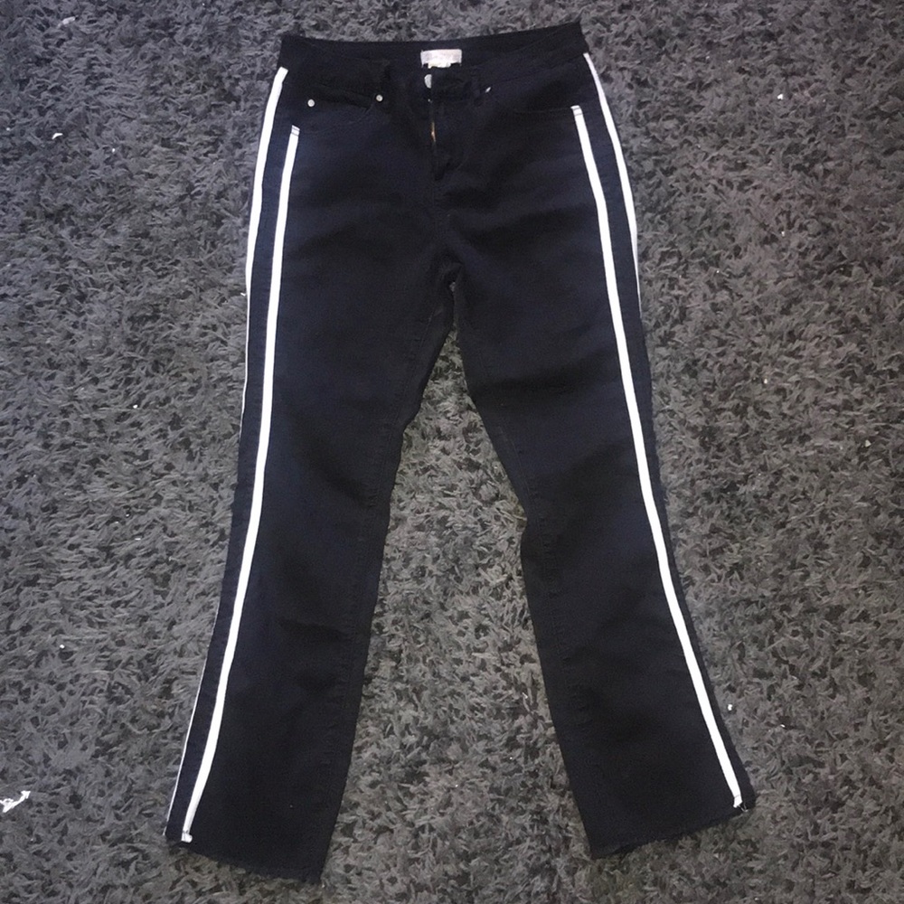 Black jeans with white stripes